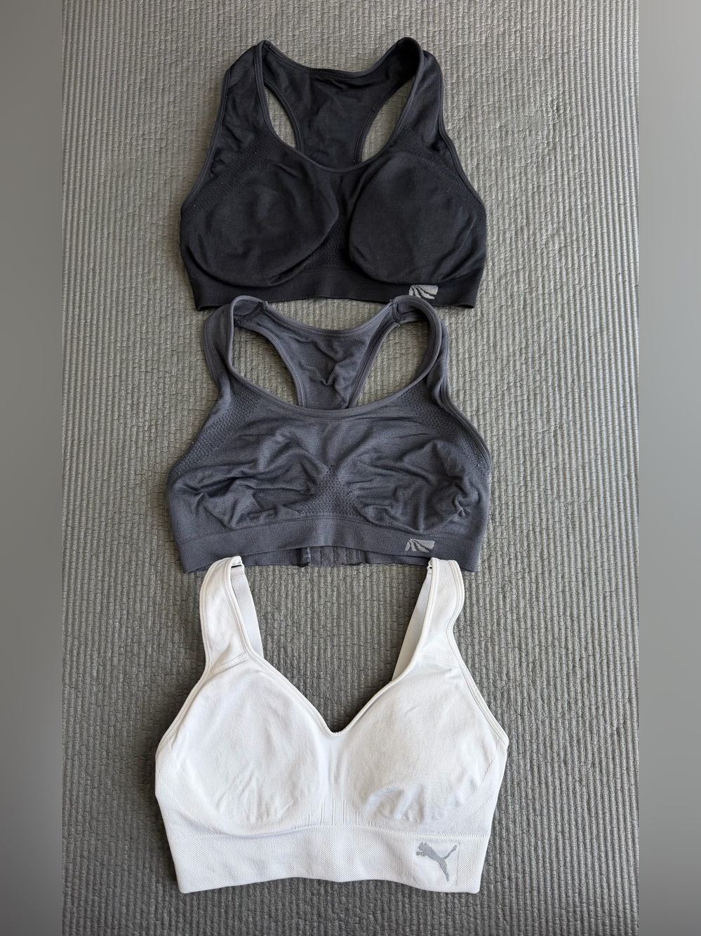 3 Sports Bra in Black, Charcoal, White PUMA and Marika brand